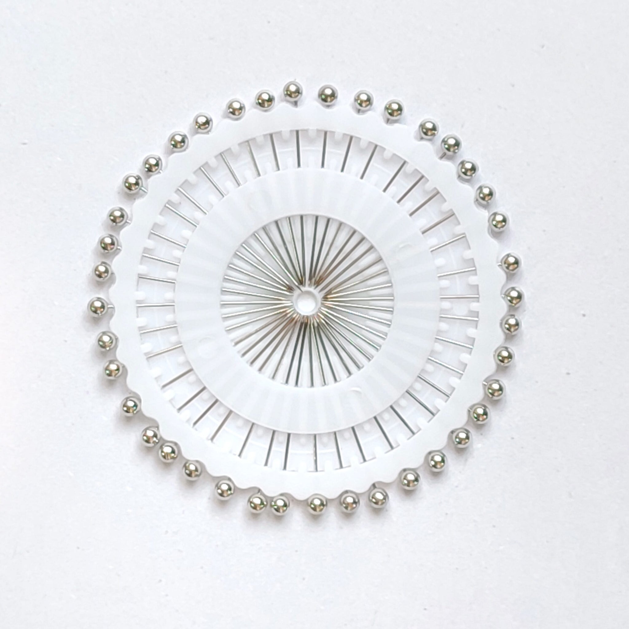 Round of Silver Pins